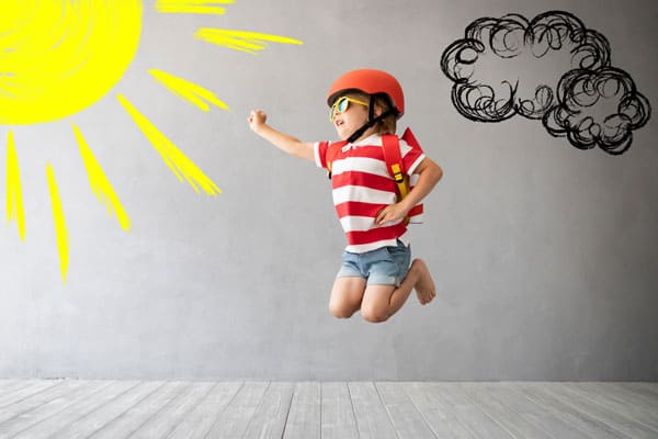 child playing as pilot with cupboard